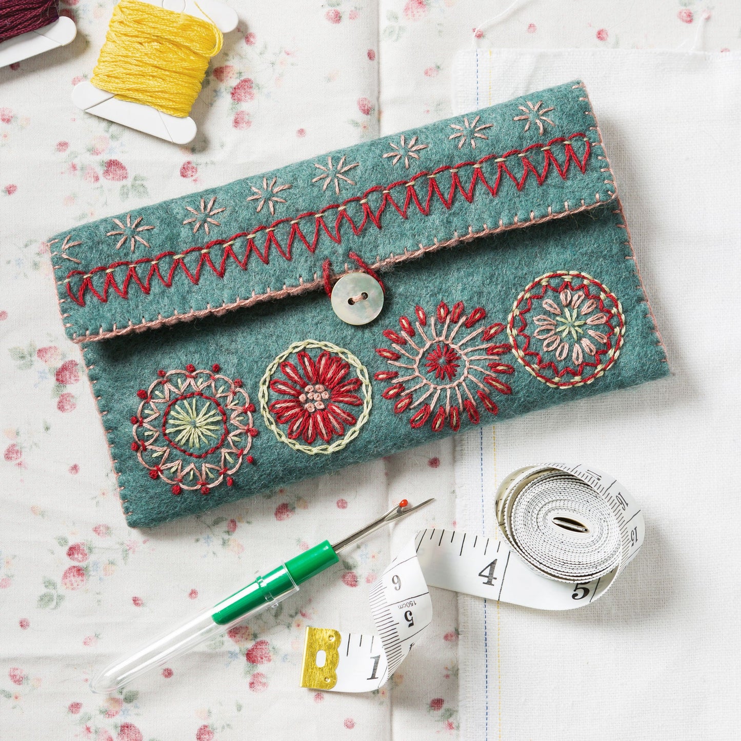 Corinne Lapierre Felt Sewing Pouch Embroidery Craft Kit. Embroidered with circles and fastened with a button.